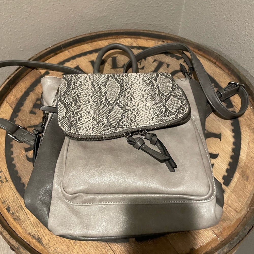 Looks like snake skin. Leather backpack purse from  The Buckle, good condition.